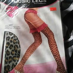 Leopard print thigh highs with pink lace.